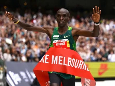 Eliud Kipchoge celebrating as he crosses the finish line in Melbourne