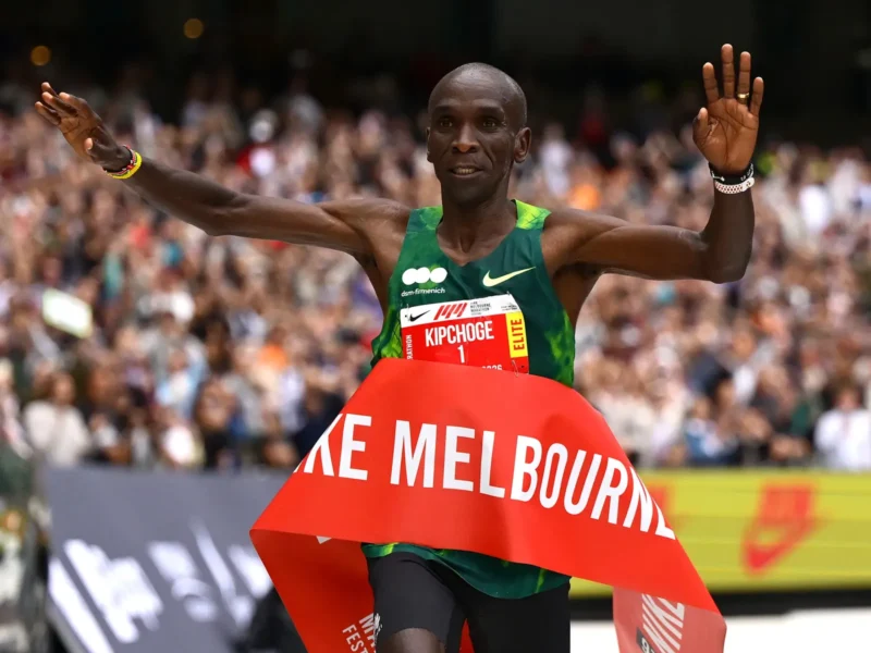 Eliud Kipchoge celebrating as he crosses the finish line in Melbourne