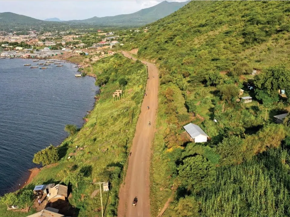 Aerial view of a road running beside Lake Victoria