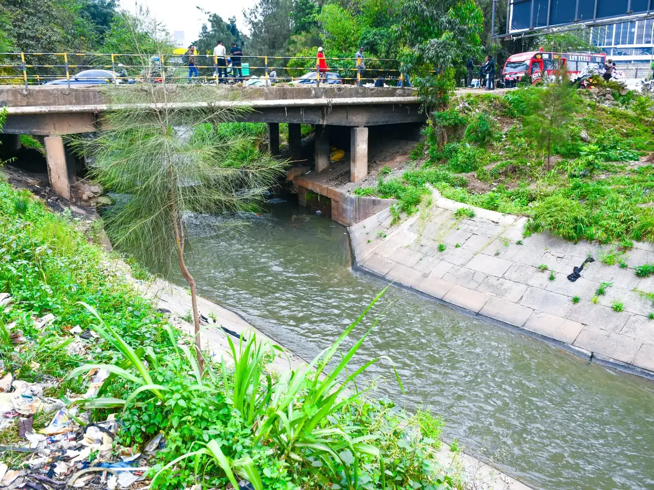 A rehabilitated channel of the Nairobi River beneath a road bridge
